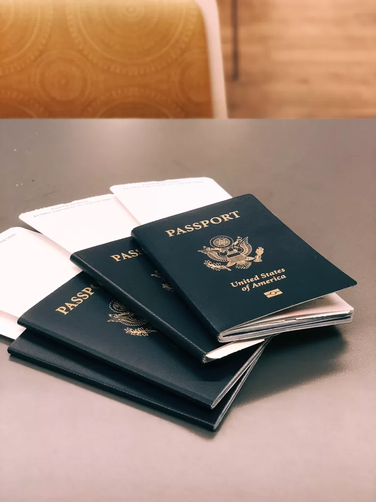 Photo of 4 American passports - a passport is a necessary step for a long-stay student visa in the Czech Republic.
